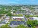 Aerial shot of a condo community surrounded by lush greenery, streets, and parking at 1100 E Bay Dr # 60, Largo, FL 33770