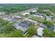 A sprawling aerial image highlighting condos near highways, shopping, and green spaces at 1100 E Bay Dr # 60, Largo, FL 33770