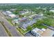 An aerial view of the condos showing beautiful green spaces and a community pool at 1100 E Bay Dr # 60, Largo, FL 33770