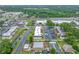 An aerial view shows the location of the condos near commercial services, highways, and green spaces at 1100 E Bay Dr # 60, Largo, FL 33770