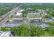 A lovely overhead view of the surrounding condos, a community pool, and verdant green spaces at 1100 E Bay Dr # 60, Largo, FL 33770