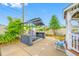 Community barbecue area with barbecue, chairs, and landscaping at 1100 E Bay Dr # 60, Largo, FL 33770