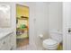 Bathroom with toilet, sink, and shelving for storage at 1100 E Bay Dr # 60, Largo, FL 33770