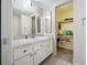 Spacious bathroom with a toilet, sink, and adjacent linen closet at 1100 E Bay Dr # 60, Largo, FL 33770