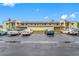 A two-story condo complex with parking, landscaping, and a classic architectural design at 1100 E Bay Dr # 60, Largo, FL 33770