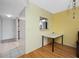 View of dining area looking to kitchen and entryway with tile and wood flooring at 1100 E Bay Dr # 60, Largo, FL 33770