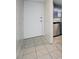 Entryway leading to kitchen featuring tile floors and stainless steel dishwasher appliance at 1100 E Bay Dr # 60, Largo, FL 33770