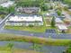 Inviting multi-Gathering building featuring manicured landscaping, ample parking, and a freshly painted roof, perfect for modern living at 1100 E Bay Dr # 60, Largo, FL 33770