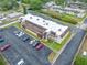 Inviting multi-Gathering building featuring manicured landscaping, ample parking, and a freshly painted roof, perfect for modern living at 1100 E Bay Dr # 60, Largo, FL 33770