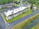 Inviting multi-Gathering building featuring manicured landscaping, ample parking, and a freshly painted roof, perfect for modern living at 1100 E Bay Dr # 60, Largo, FL 33770
