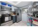 The kitchen features stainless steel appliances and a stainless steel shelving unit at 1100 E Bay Dr # 60, Largo, FL 33770