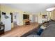 Spacious living room with wood floors, a couch, and views of other rooms at 1100 E Bay Dr # 60, Largo, FL 33770