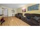 Living room with laminate flooring, couches, and a view of the kitchen at 1100 E Bay Dr # 60, Largo, FL 33770
