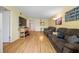 Living room with laminate flooring, couches, a TV, and views of other rooms at 1100 E Bay Dr # 60, Largo, FL 33770