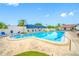Community pool with chairs and palm trees at 1100 E Bay Dr # 60, Largo, FL 33770