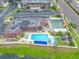 Community swimming pool with crystal-clear water, lounge chairs, and poolside gazebo, perfect for relaxation and summer enjoyment at 1100 E Bay Dr # 60, Largo, FL 33770