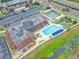 Community swimming pool with crystal-clear water, lounge chairs, and poolside gazebo, perfect for relaxation and summer enjoyment at 1100 E Bay Dr # 60, Largo, FL 33770