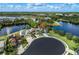 An aerial view showing the home is near water and other homes in a neighborhood at 11320 Lazy Hickory Ln, Tampa, FL 33635