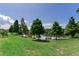Expansive backyard with lush green grass and a serene lake view at 11320 Lazy Hickory Ln, Tampa, FL 33635