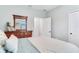 Bedroom featuring a wooden dresser and decor; a comfy and calming space at 11320 Lazy Hickory Ln, Tampa, FL 33635