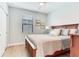 Comfortable bedroom featuring a ceiling fan and light-filled window at 11320 Lazy Hickory Ln, Tampa, FL 33635