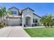 Charming two-story home with manicured lawn, inviting entrance, and elegant curb appeal at 11320 Lazy Hickory Ln, Tampa, FL 33635