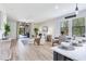 Cozy and open living room and dining area offer lots of natural light and a backyard view at 11320 Lazy Hickory Ln, Tampa, FL 33635