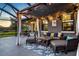 Inviting screened-in patio with comfortable seating, ceiling fans, and view of lush greenery at 11320 Lazy Hickory Ln, Tampa, FL 33635