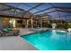 Backyard pool with lounge chairs and spa, perfect for outdoor relaxation and entertainment at 11320 Lazy Hickory Ln, Tampa, FL 33635