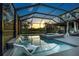 Enclosed backyard pool and spa, offering a serene outdoor living space at 11320 Lazy Hickory Ln, Tampa, FL 33635