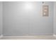 Clean basement features painted block walls and updated electrical panel at 11619 Fox Creek Dr, Tampa, FL 33635