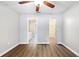 This bedroom has hardwood floors, an ensuite bathroom, and a walk-in closet at 11619 Fox Creek Dr, Tampa, FL 33635