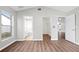 This bedroom has hard wood floors with multiple entrances to a bathroom, closet and hallway at 11619 Fox Creek Dr, Tampa, FL 33635
