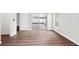 Bright bedroom featuring wood floors and glass sliding doors leading to a patio at 11619 Fox Creek Dr, Tampa, FL 33635