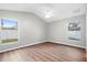 This bedroom has a fan, hardwood floors and plenty of sunlight from the windows at 11619 Fox Creek Dr, Tampa, FL 33635