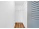 A walk-in closet with wire shelving and attractive wood flooring at 11619 Fox Creek Dr, Tampa, FL 33635