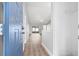 Bright and airy foyer featuring sleek flooring, neutral walls, and an open view into the living space at 11619 Fox Creek Dr, Tampa, FL 33635