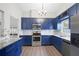 Renovated kitchen featuring new cabinets, backsplash, and stainless steel appliances at 11619 Fox Creek Dr, Tampa, FL 33635