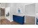 Convenient laundry area with modern washer/dryer and custom cabinetry at 11619 Fox Creek Dr, Tampa, FL 33635