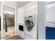 Modern washer and dryer in dedicated laundry space, next to garage at 11619 Fox Creek Dr, Tampa, FL 33635