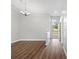 Open-concept living room with sleek flooring, neutral tones, and a seamless transition to the dining and kitchen areas at 11619 Fox Creek Dr, Tampa, FL 33635