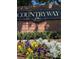 Community sign with colorful flower bed at 11619 Fox Creek Dr, Tampa, FL 33635