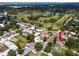 Aerial view of the property's location near a golf course and a residential area, highlighting community amenities at 119 N Hillcrest Ave, Clearwater, FL 33755