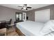 Comfortable bedroom featuring warm lighting and laminate flooring at 119 N Hillcrest Ave, Clearwater, FL 33755