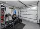 Garage containing work out equipment and storage shelves for convenience and organization at 119 N Hillcrest Ave, Clearwater, FL 33755