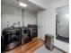 Convenient laundry area featuring modern appliances, plenty of storage, and a stainless steel trash can at 119 N Hillcrest Ave, Clearwater, FL 33755
