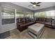 Cozy living room filled with lots of natural light from all of the surrounding windows at 119 N Hillcrest Ave, Clearwater, FL 33755