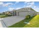 A beautifully landscaped single-Gathering home features a spacious driveway and a two-car garage at 12436 Shining Willow St, Riverview, FL 33579