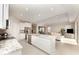 Modern kitchen with an island and open concept layout with easy access to the living room at 12436 Shining Willow St, Riverview, FL 33579