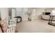 Open-concept living area with great natural light, tile floors and neutral walls at 12436 Shining Willow St, Riverview, FL 33579